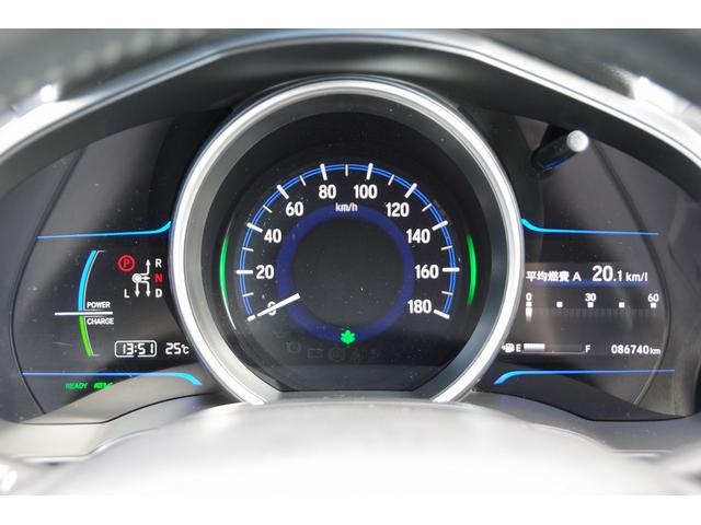 フィットハイブリッド Ｌパッケージ　電動格納式ミラー　ＡＵＴＯライト　ナビ＆ＴＶ　地デジフルセグＴＶ　ＵＳＢ　サイドエアバック　ＤＶＤ再生　バックカメラ　オートクルーズコントロール　イモビライザー　ＥＴＣ　ＥＳＣ　ＡＵＴＯエアコン（31枚目）