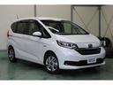 フリードハイブリッド ハイブリッド・Ｇホンダセンシング　Ｈｏｎｄａ　ＳＥＮＳＨＩＮＧ　純正９インチナビ　バックカメラ　ＥＴＣ　両側電動スライドドア　ＬＥＤヘッドライト＋コーナーリングライト　オートリトラミラー　シートヒーター　ワンオーナー（5枚目）