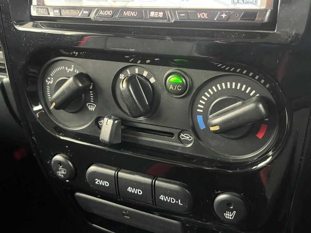 ジムニー クロスアドベンチャー　ワンオーナー　禁煙車　ターボ　ルーフキャリア　社外サス　純正１６インチＡＷ　ジオランダーオフロードタイヤ　Ｐａｎａｓｏｎｉｃ製ＳＤナビ　ワンセグＴＶ　シートヒーター　キーレス　電動格納ミラー（6枚目）