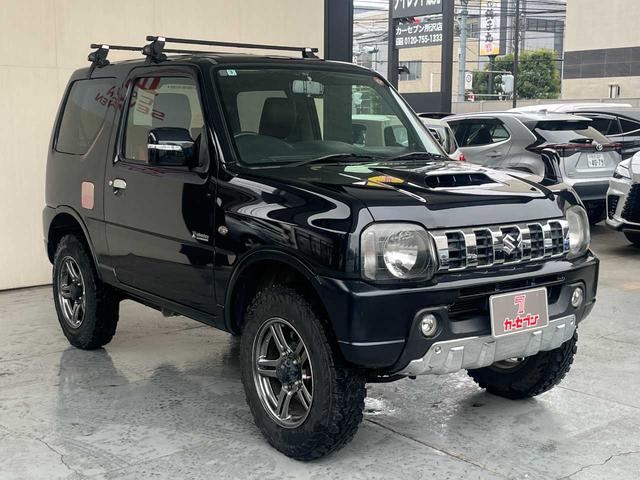 ジムニー クロスアドベンチャー　ワンオーナー　禁煙車　ターボ　ルーフキャリア　社外サス　純正１６インチＡＷ　ジオランダーオフロードタイヤ　Ｐａｎａｓｏｎｉｃ製ＳＤナビ　ワンセグＴＶ　シートヒーター　キーレス　電動格納ミラー（18枚目）