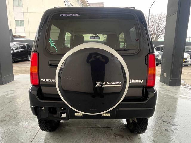 ジムニー クロスアドベンチャー　ワンオーナー　禁煙車　ターボ　ルーフキャリア　社外サス　純正１６インチＡＷ　ジオランダーオフロードタイヤ　Ｐａｎａｓｏｎｉｃ製ＳＤナビ　ワンセグＴＶ　シートヒーター　キーレス　電動格納ミラー（21枚目）