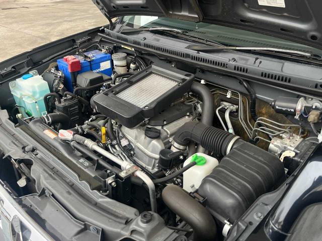 ジムニー クロスアドベンチャー　ワンオーナー　禁煙車　ターボ　ルーフキャリア　社外サス　純正１６インチＡＷ　ジオランダーオフロードタイヤ　Ｐａｎａｓｏｎｉｃ製ＳＤナビ　ワンセグＴＶ　シートヒーター　キーレス　電動格納ミラー（30枚目）