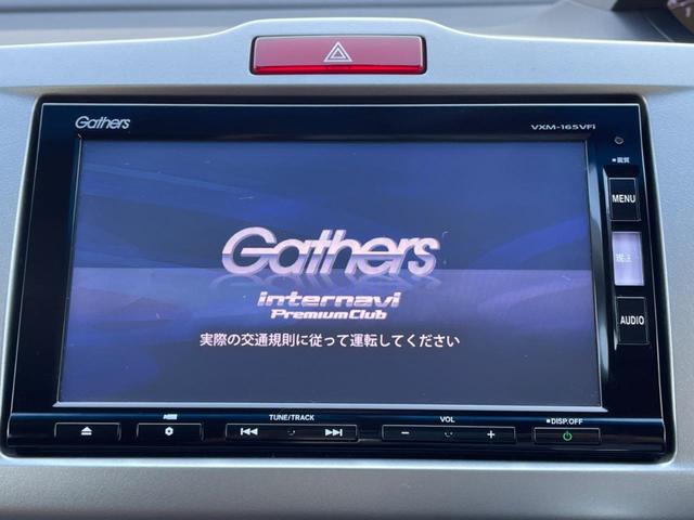 フリードハイブリッド ハイブリッド プレミアムエディション 両側電動スライドドア 純正ナビ バックカメラ 禁煙車 スマートキー ETC クルコン オートライト オートエアコン Bluetooth CD/DVD再生 フルセグ 革巻きステアリング(5枚目)