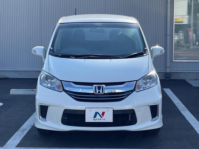 フリードハイブリッド ハイブリッド プレミアムエディション 両側電動スライドドア 純正ナビ バックカメラ 禁煙車 スマートキー ETC クルコン オートライト オートエアコン Bluetooth CD/DVD再生 フルセグ 革巻きステアリング(15枚目)