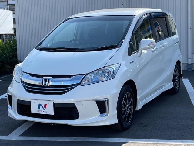 フリードハイブリッド ハイブリッド プレミアムエディション 両側電動スライドドア 純正ナビ バックカメラ 禁煙車 スマートキー ETC クルコン オートライト オートエアコン Bluetooth CD/DVD再生 フルセグ 革巻きステアリング(25枚目)