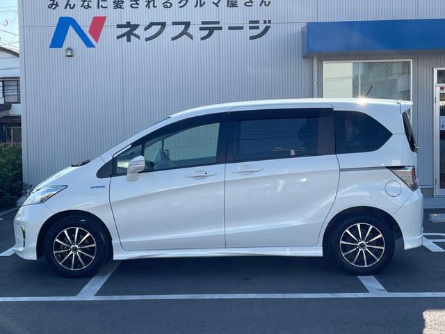 フリードハイブリッド ハイブリッド プレミアムエディション 両側電動スライドドア 純正ナビ バックカメラ 禁煙車 スマートキー ETC クルコン オートライト オートエアコン Bluetooth CD/DVD再生 フルセグ 革巻きステアリング(26枚目)