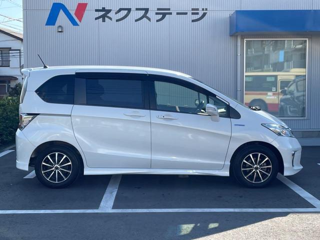 フリードハイブリッド ハイブリッド プレミアムエディション 両側電動スライドドア 純正ナビ バックカメラ 禁煙車 スマートキー ETC クルコン オートライト オートエアコン Bluetooth CD/DVD再生 フルセグ 革巻きステアリング(28枚目)