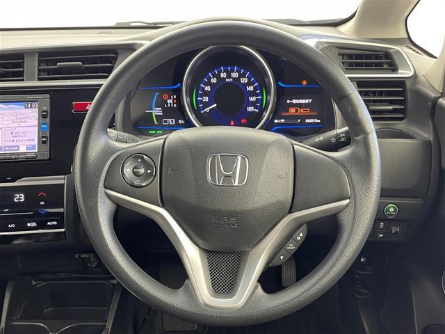 フィットハイブリッド Ｆパッケージ　純正ナビ　バックカメラ　ＥＴＣ　前後ドラレコ　フルセグＴＶ　ＨＩＤヘッドライト　ライトリベライザー　ＵＳＢ入力端子　プッシュスタートボタン　スマートキー　ステアリングスイッチ　横滑り防止装置　禁煙車（9枚目）