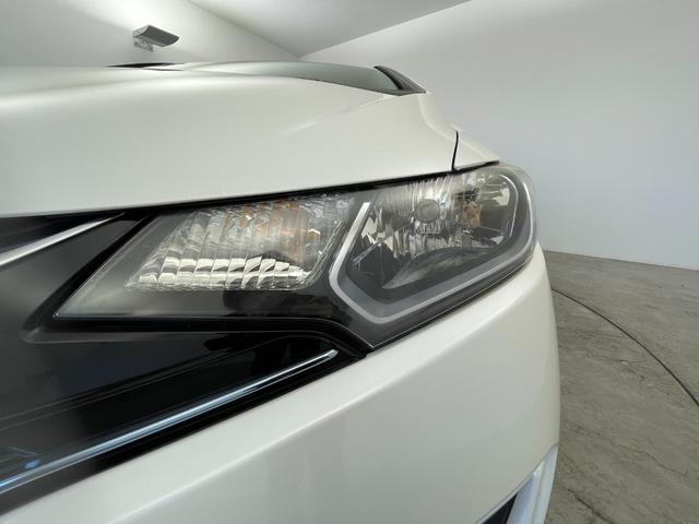 フィットハイブリッド Ｆパッケージ　純正ナビ　バックカメラ　ＥＴＣ　前後ドラレコ　フルセグＴＶ　ＨＩＤヘッドライト　ライトリベライザー　ＵＳＢ入力端子　プッシュスタートボタン　スマートキー　ステアリングスイッチ　横滑り防止装置　禁煙車（59枚目）