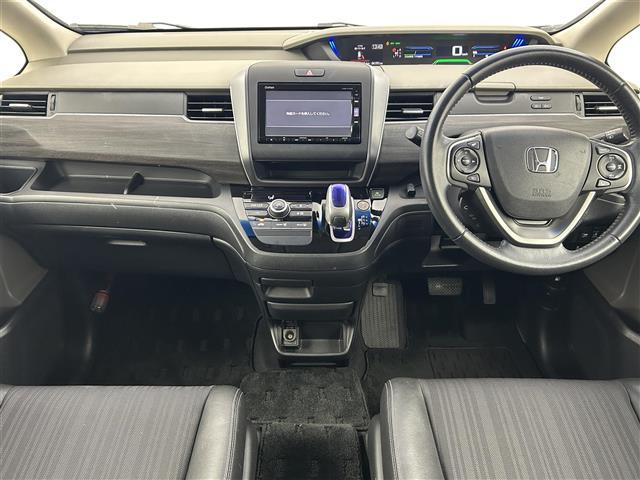 フリードハイブリッド ハイブリッド・Gホンダセンシング 禁煙 純正7型ナビ 両側電動スライドドア LEDヘッドライト レーダークルーズコントロール フルセグTV 電動格納サイドミラー ビルトインETC バックカメラ ハーフレザーシート 純正フロアマット(2枚目)
