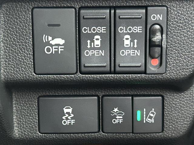 フリードハイブリッド ハイブリッド・Gホンダセンシング 禁煙 純正7型ナビ 両側電動スライドドア LEDヘッドライト レーダークルーズコントロール フルセグTV 電動格納サイドミラー ビルトインETC バックカメラ ハーフレザーシート 純正フロアマット(6枚目)