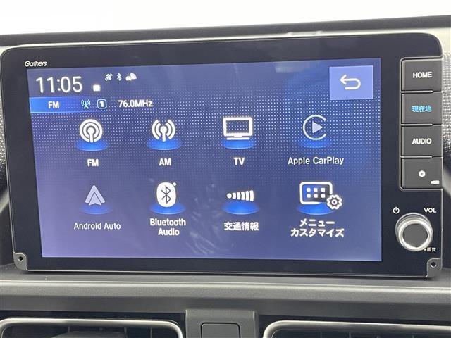 フリード ｅ：ＨＥＶエアー　ＥＸ　登録済未使用車　純正９型メモリナビ　ホンダセンシング　両側パワースライドドア　ブラインドスポットインフォメーション　パーキングセンサー　レーダークルーズコントロール　バックカメラ　ハーフレザーシート（5枚目）
