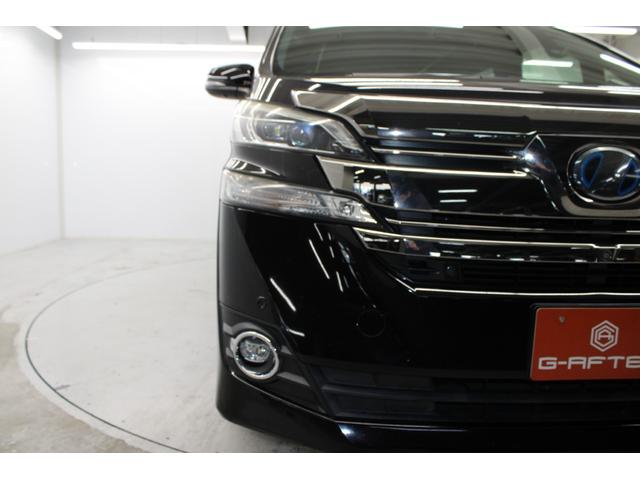 ヴェルファイアハイブリッド エグゼクティブラウンジ　禁煙車　純正１０インチナビ　ＪＢＬサウンド　全周囲カメラ　革シート　両側電動ドア　レーダークルーズ　シートヒーター　後席モニター　応急用スペアタイヤ　オットマン　電動リアゲート　パワーシート（12枚目）