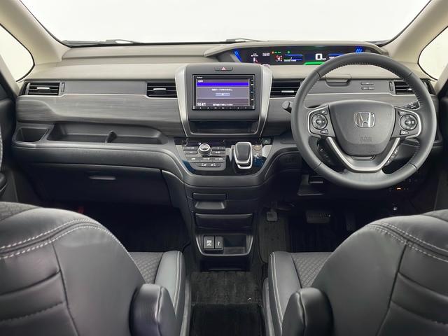 フリードハイブリッド ハイブリッド・Ｇホンダセンシング　純正ナビ　バックカメラ　両側パワースライドドア　ビルトインＥＴＣ　アダプティブクルーズコントロール　前席シートヒーター　レーンキープアシスト　純正アルミホイール　ＬＥＤヘッドライト　純正フロアマット（8枚目）