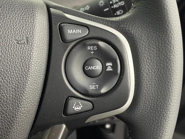 フリードハイブリッド ハイブリッド・Ｇホンダセンシング　純正ナビ　バックカメラ　両側パワースライドドア　ビルトインＥＴＣ　アダプティブクルーズコントロール　前席シートヒーター　レーンキープアシスト　純正アルミホイール　ＬＥＤヘッドライト　純正フロアマット（12枚目）