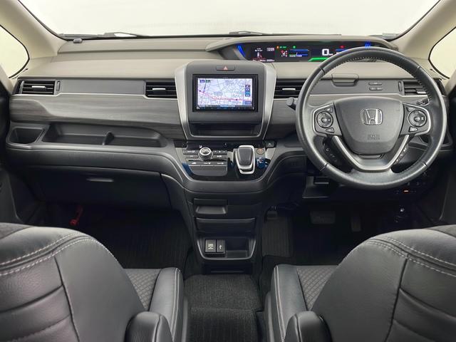 フリードハイブリッド ハイブリッド・Gホンダセンシング 社外ナビ バックカメラ 前方ドライブレコーダー ビルトインETC アダプティブクルーズコントロール 衝突軽減ブレーキ 車線逸脱警報 先行車発進 標識認識 社外フロアマット 純正18インチアルミホイール(8枚目)