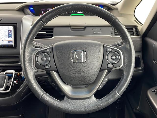 フリードハイブリッド ハイブリッド・Gホンダセンシング 社外ナビ バックカメラ 前方ドライブレコーダー ビルトインETC アダプティブクルーズコントロール 衝突軽減ブレーキ 車線逸脱警報 先行車発進 標識認識 社外フロアマット 純正18インチアルミホイール(10枚目)