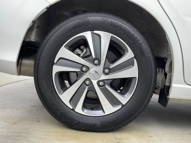 フリードハイブリッド ハイブリッド・Gホンダセンシング 社外ナビ バックカメラ 前方ドライブレコーダー ビルトインETC アダプティブクルーズコントロール 衝突軽減ブレーキ 車線逸脱警報 先行車発進 標識認識 社外フロアマット 純正18インチアルミホイール(70枚目)