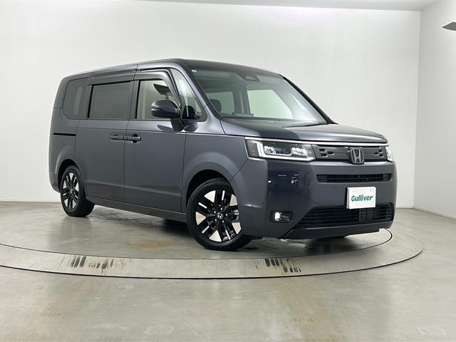 ステップワゴン e:HEVエアー EX フリップダウンモニター 純正ナビ 全方位カメラ BSM ビルトインETC 前席シートヒーター パワーバックドア レーダークルーズコントロール 衝突軽減システム 両側パワースライドドア オットマン(66枚目)