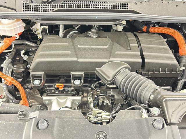 ステップワゴン e:HEVエアー EX フリップダウンモニター 純正ナビ 全方位カメラ BSM ビルトインETC 前席シートヒーター パワーバックドア レーダークルーズコントロール 衝突軽減システム 両側パワースライドドア オットマン(78枚目)