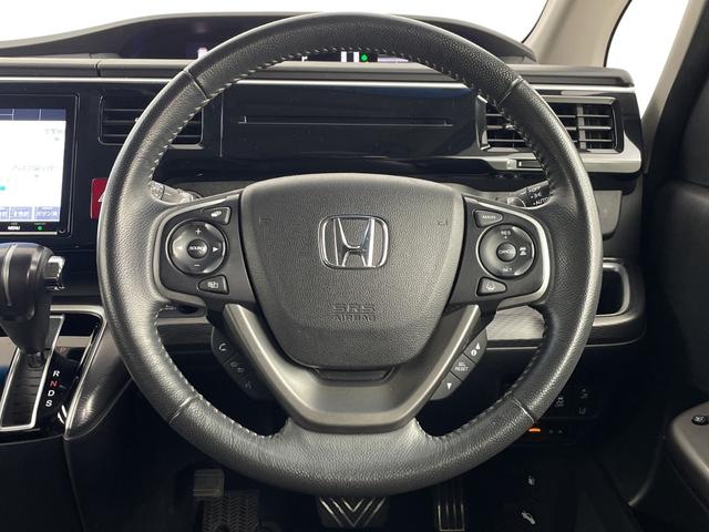 ステップワゴンスパーダ スパーダ・クールスピリット　ホンダセンシングブラスタ　純正フリップダウンモニター　純正９インチナビ　バックカメラ　ビルトインＥＴＣ　両側パワースライドドア　前席シートヒーター　レーダークルーズコントロール　衝突軽減システム　純正アルミホイール　ＬＥＤ（9枚目）