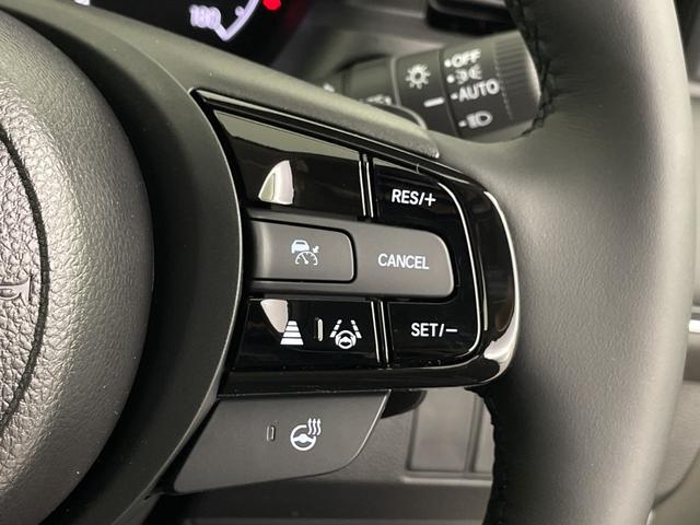 ヴェゼル ｅ：ＨＥＶ　Ｚ　登録済未使用車　純正ナビ　バックカメラ　ビルトインＥＴＣ２．０　ＢＳＭ　ワイヤレス充電器　前席シートヒーター　ステアリングヒーター　電動リアゲート　衝突軽減ブレーキ　アダプティブクルーズコントロール（12枚目）