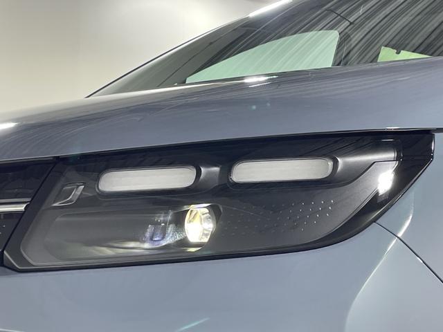 フリード ｅ：ＨＥＶエアー　ＥＸ　登録済未使用車　純正９型ディスプレイオーディオ　ナビ　バックカメラ　フルセグ　両側電動　ホンダセンシング　革巻ステアリング　前席シートヒーター　ＡＨＢ　ＬＥＤヘッドランプ　スマートキー　プッシュＳ（65枚目）