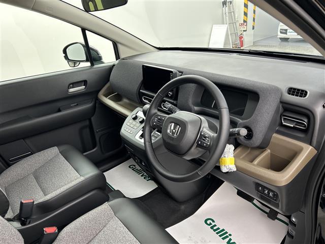 フリード e:HEVエアー EX 登録済未使用車 純正9型ナビ 温シート LED バックカメラ Bluetooth USB端子 フルセグTV BSM ホンダセンシング スマートキー 両側電動 純正15インチAW 衝突被害軽減システム(23枚目)