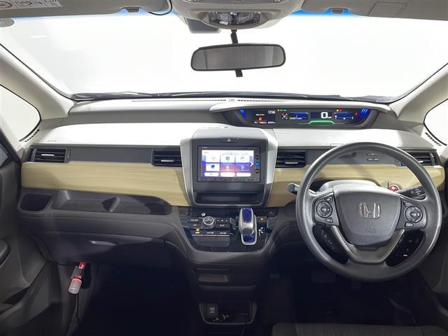 フリードハイブリッド ハイブリッド・Ｇホンダセンシング　県外仕入れ　禁煙車　６名乗り　純正ナビ　ワンセグ　ＣＤ　Ｂｌｕｅｔｏｏｔｈ　両側パワースライドドア　ホンダセンシング　クルーズコントロール　ビルトインＥＴＣ　スマートキー　スペアキー１本（2枚目）