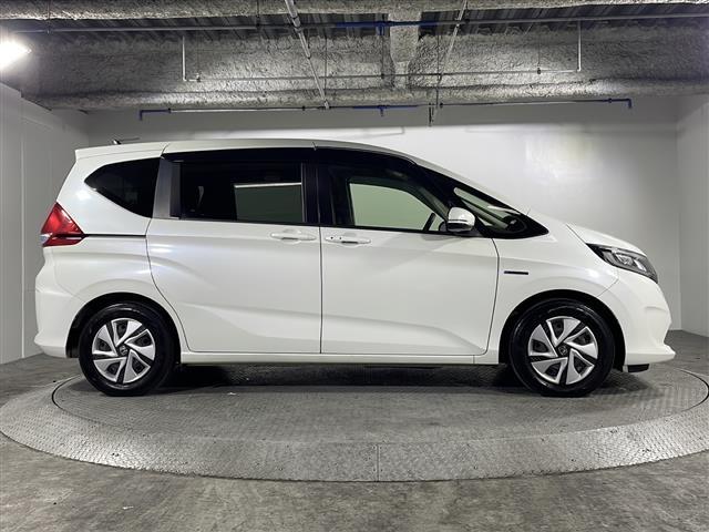 フリードハイブリッド ハイブリッド・Ｇホンダセンシング　県外仕入れ　禁煙車　６名乗り　純正ナビ　ワンセグ　ＣＤ　Ｂｌｕｅｔｏｏｔｈ　両側パワースライドドア　ホンダセンシング　クルーズコントロール　ビルトインＥＴＣ　スマートキー　スペアキー１本（30枚目）