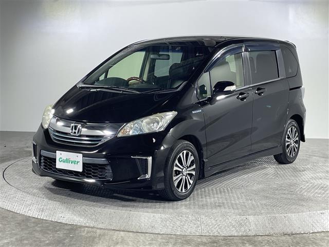 フリードハイブリッド ジャストセレクション　禁煙車　両側電動パワースライドドア　社外サブウーファー　社外ナビ　（ＣＤ／Ｂｌｕｅｔｏｏｔｈ／フルセグＴＶ）　バックカメラ　革調シートカバー　社外ツイーター　純正ラバーマット　オートライト　ＥＴＣ（30枚目）