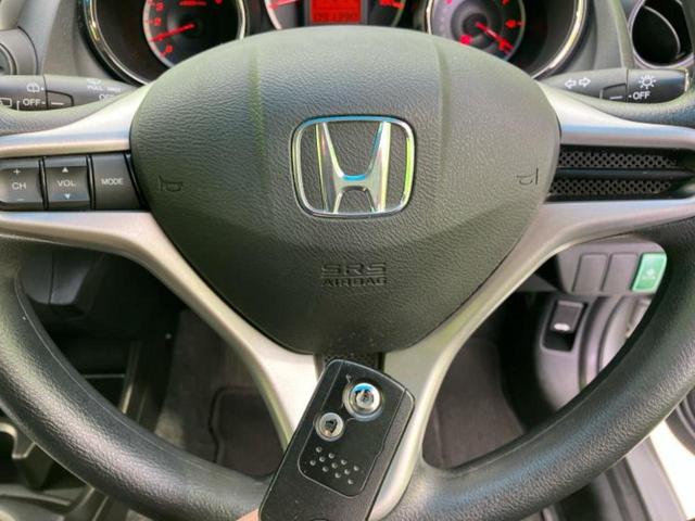 フィット 13G・スマートセレクションファインスタイル 新品タイヤ/社外 メモリーナビ/パーキングアシスト バックガイド/Bluetooth接続/ETC/バックモニター/フルセグTV/エアバッグ 運転席/エアバッグ 助手席/パワーウインドウ バックカメラ(32枚目)