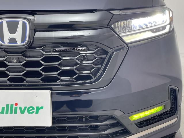 オデッセイハイブリッド ｅ：ＨＥＶアブソルート・ＥＸ　純正１０型ナビ　Ｂｌｕｅｔｏｏｔｈ　純正フリップダウンモニター　両側パワースライドドア　パワーバックドア　前席パワーシート　前席シートヒーター　ハーフレザーシート　ＢＳＭ　ＣＭＢＳ　ＡＣＣ先行車発進（65枚目）