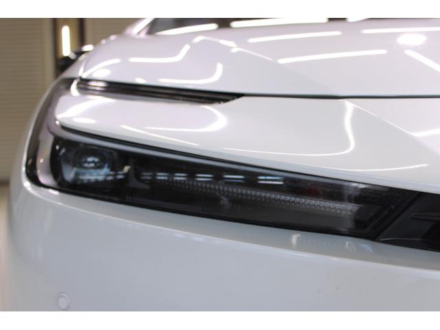 プリウス Z 禁煙車 サンルーフ 純正12.3型ディスプレイオーディオプラス フルセグTV 全周囲カメラ 寒冷地仕様 温冷黒革シート ステアリングヒーター 100V電源 ブラインドスポットモニター 電動リアゲート(19枚目)