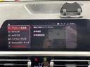 320d xDrive Mスポーツ 禁煙車 4WD 純正ナビ 全周囲カメラ 電動バックドア アクティブクルーズコントロール フルセグTV 前後ドライブレコーダー 前席パワーシート シートヒーター Wエアコン 純正AW付サマータイヤ車載(26枚目)