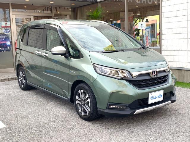 フリードハイブリッド ハイブリッド・クロスターホンダセンシング OP10年保証対象車 純正9インチナビ 前後ドライブレコーダー ハーフレザーシート ビルトインETC 両側パワースライドドア LEDヘッドライト レーダークルーズコントロール シートヒーター(3枚目)