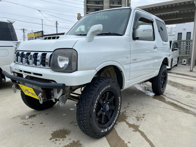 ジムニー 　Ｘアドベンチャー　５ＭＴ　県外仕入れ　リフトアップ　社外マフラー　社外バンパー　ＴＶ　４ＷＤ　ナビ　ＴＶ　電動格納ミラー　シートヒーター　　ＣＤ　ＵＳＢ　アルミホイール　エアコン　パワーウィンドウ（10枚目）