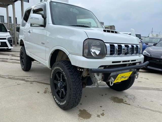 ジムニー 　Ｘアドベンチャー　５ＭＴ　県外仕入れ　リフトアップ　社外マフラー　社外バンパー　ＴＶ　４ＷＤ　ナビ　ＴＶ　電動格納ミラー　シートヒーター　　ＣＤ　ＵＳＢ　アルミホイール　エアコン　パワーウィンドウ（14枚目）
