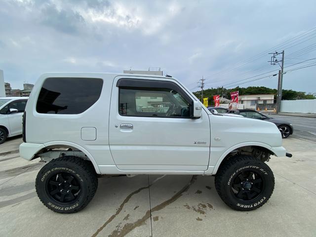 ジムニー 　Ｘアドベンチャー　５ＭＴ　県外仕入れ　リフトアップ　社外マフラー　社外バンパー　ＴＶ　４ＷＤ　ナビ　ＴＶ　電動格納ミラー　シートヒーター　　ＣＤ　ＵＳＢ　アルミホイール　エアコン　パワーウィンドウ（15枚目）