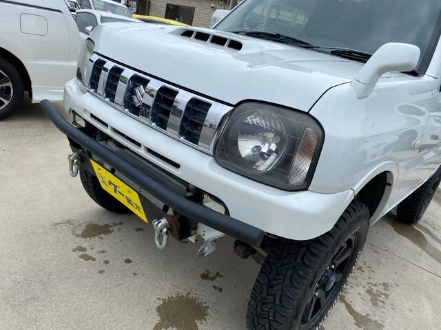 ジムニー 　Ｘアドベンチャー　５ＭＴ　県外仕入れ　リフトアップ　社外マフラー　社外バンパー　ＴＶ　４ＷＤ　ナビ　ＴＶ　電動格納ミラー　シートヒーター　　ＣＤ　ＵＳＢ　アルミホイール　エアコン　パワーウィンドウ（27枚目）