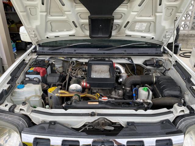 ジムニー 　Ｘアドベンチャー　５ＭＴ　県外仕入れ　リフトアップ　社外マフラー　社外バンパー　ＴＶ　４ＷＤ　ナビ　ＴＶ　電動格納ミラー　シートヒーター　　ＣＤ　ＵＳＢ　アルミホイール　エアコン　パワーウィンドウ（34枚目）