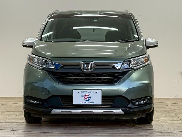 フリードハイブリッド ハイブリッド・クロスター 1オーナー 純正9型ナビ フリップダウンモニター 衝突軽減 レーンキープアシスト クルーズコントロール 両側電動 コーナーセンサー 6人乗り Bluetooth ウォークスルー バックカメラ(21枚目)