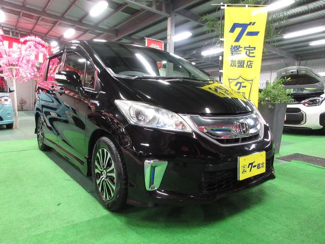 沖縄県の中古車ならフリードハイブリッド ジャストセレクション　・　純正９インチナビ＆フルセグ・キセノン・バックカメラ・ツインパワードア・ハーフレザーＶｒ