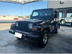 ジープ・ラングラー サハラ ワンオーナー車/ハードトップ/ETC付き/盗難防止システム/クルーズコントロール/本革巻きステアリング/プライバシーガラス/イモビライザー/パワーステアリング/プライバシーガラス/15インチホイール 中古車画像