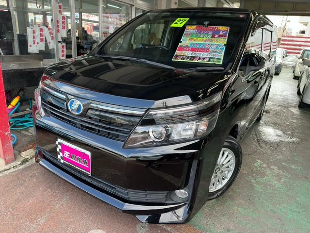 沖縄県宜野湾市の中古車ならヴォクシー ハイブリッドＶ　社外１０インチナビ　フルセグＴＶ　Ｂｌｕｅｔｏｏｔｈ　バックカメラ　シートカバー　両側パワースライドドア　ＥＴＣ　クルーズコントロール　後席エアコン