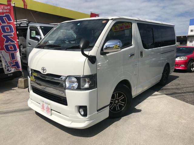 沖縄県の中古車ならレジアスエースバン 　４型フェイスチェンジカスタム　フロントスポイラー　オプショングリル　社外ナビ　バックカメラ　ダブルエアコン　１００Ｖ電源　インテリアパネル　レザーシートカバー　社外ＬＥＤテールレンズ