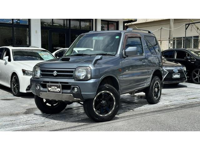 沖縄県の中古車ならジムニー ランドベンチャー　リフトアップ　社外１６インチアルミ　社外ショック　サスペンション　ジオランダーＡＴタイヤ　社外調整式ラテラルロッド　ヒーター内臓ハーフレザーシート　ドラレコ　Ｂｌｕｅｔｏｏｔｈ内蔵社外ナビ　背面タイヤ