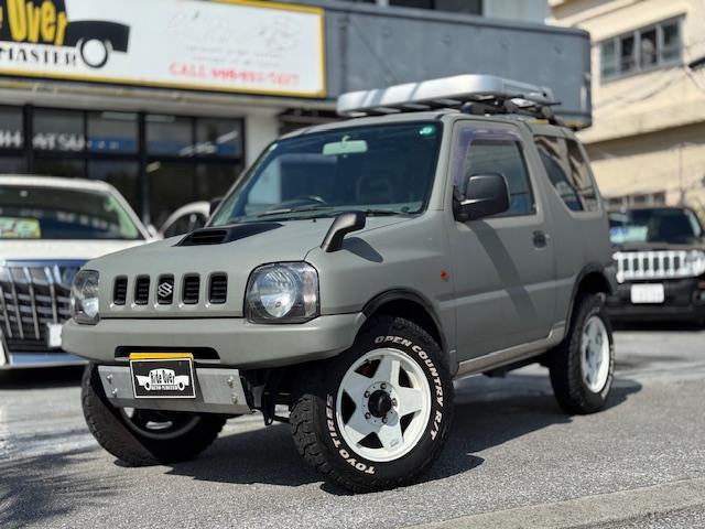 沖縄県の中古車ならジムニー ＸＣ　マットグレーオールペン済　社外１６アルミ　オープンカントリーＲＴタイヤ　社外Ｅ＆Ｒバンパー　社外マフラー　Ｆ調整式ラテラルロッド　スキッドプレート　タンクガード　社外エアクリ　ルーフラック　コイル新品
