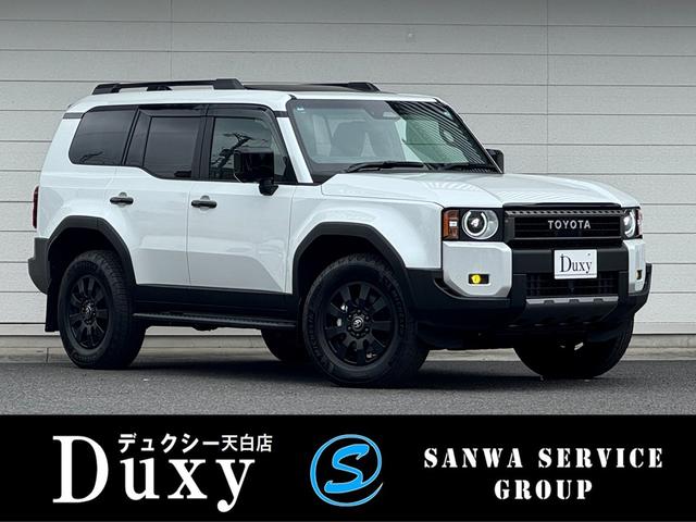 ランドクルーザー250(トヨタ) ZXファーストエディション 内装ブラウン ディーゼルターボ 丸目ヘッドランプ 12.3型JBLコネクトナビ ヘッドアップディスプレイ シートヒーター&ベンチレーション 電動ルーフ 電動格納サードシート シートメモリ 置くだけ充電 中古車画像