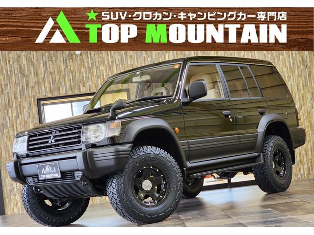 ワイド　エクシード　ディーゼルターボ　三菱ＯＰカラーエメラルドブラックパール全塗装済み　切替４ＷＤ　サンルーフ　リフトアップ　ＸＪ０５－１６インチ　ジオランダーＸ－ＡＴ　ダブルエアコン　キーレス　電格ミラー　ＥＴＣ